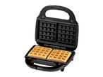Open waffle maker with two golden-brown square waffles inside, on a white background.