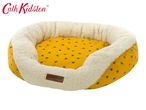 Cath Kidston yellow pet bed with a bee pattern and a cream fluffy interior.