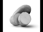 A whole potato and two sliced potato pieces on a white background.