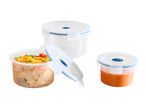 Three round plastic food storage containers, one empty, one with pasta, and one with soup