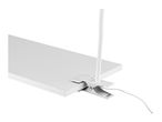 White clip-on lamp attached to a white shelf