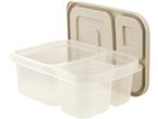 A beige plastic food container with four compartments and a clear lid.