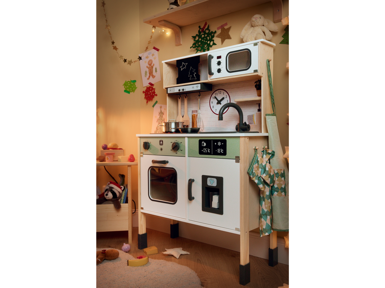 Playtive Wooden Play Kitchen with Christmas decorations and accessories.