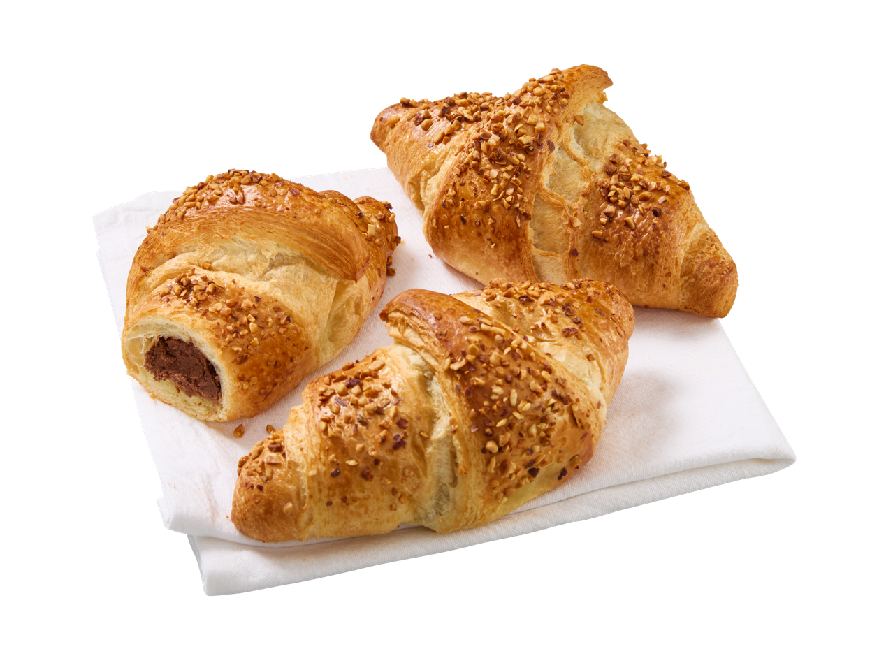 Trei croissante cu nuci, unul cu umplutură de ciocolată, pe un șervețel alb