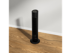 Black tower fan on a wood floor.