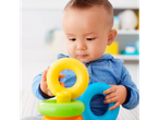Baby playing with a colorful ring stacker
