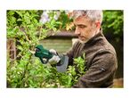 A man prunes a bush with a cordless electric pruning shear.