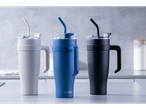 Facelmann travel mugs with lids and straws, in three colors.