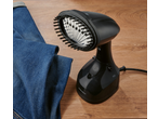 SILVERCREST® Garment Steamer with brush attachment next to blue jeans on a wooden surface.