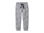 Grey children's joggers with a black drawstring and an all-over dinosaur print.