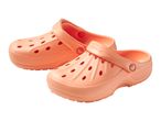 Pair of light orange clogs with ventilation holes and textured soles
