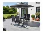 Patio dining set with black table and four chairs under a large black umbrella on a sunny day.