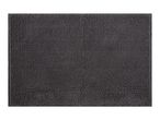 A dark gray bath mat with a textured surface.