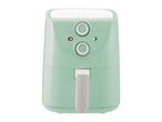 A mint green air fryer with two control dials and indicator lights.