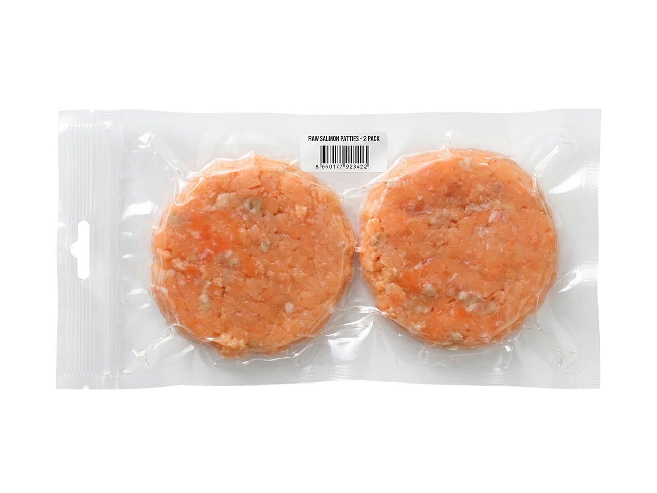 Kaks toorest lõhepihvi vaakumpakendis, sildil tekst 'RAW SALMON PATTIES - 2 PACK'.