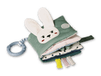 Niedlicher Stoffhase mit integriertem Buch, ideal für Babys und Kleinkinder.