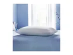 A white Silentnight pillow rests on a blue bedspread in a bedroom with a window.