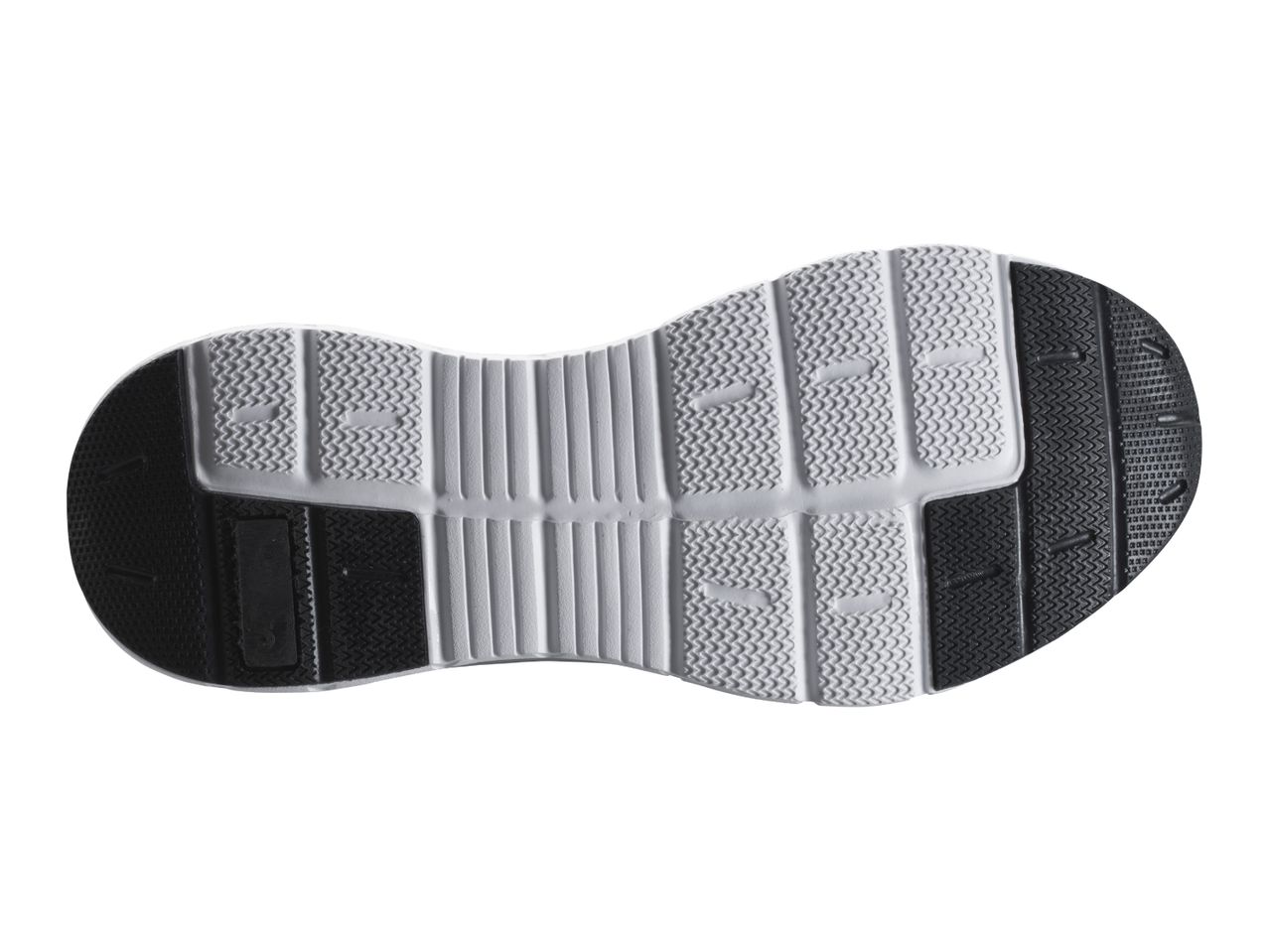 Underside of a black and white shoe sole with a textured pattern