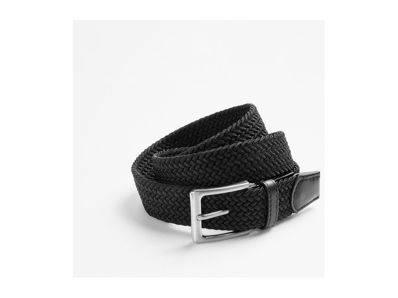 Black braided elastic belt with a silver buckle, coiled on a white background.
