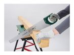 Hands in safety gloves sawing a wooden beam on a workbench with a hand saw.