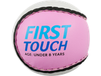 Pink training sliotar with 'FIRST TOUCH AGE: UNDER 8 YEARS' in blue text.
