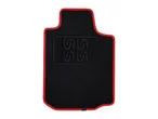 Black car floor mat with red trim and logo.