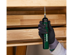 PARKSIDE electric screwdriver screwing a screw into a wooden shelf