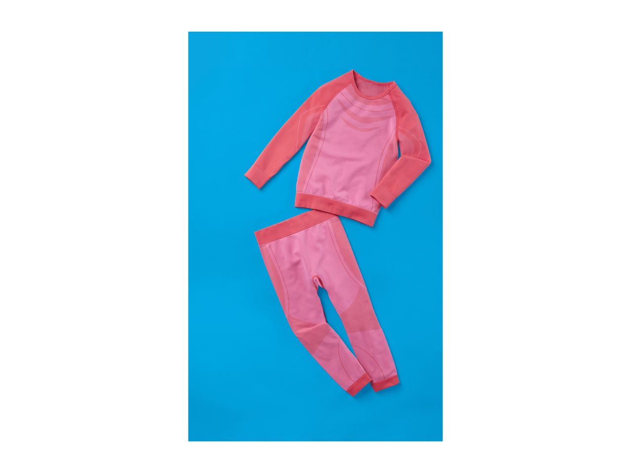 Pink thermal underwear set for women on a blue background