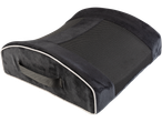 A black lumbar support cushion with mesh center and carrying strap.