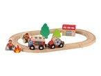 Wooden fire station train set with fire engine, fire hose car, firefighters, fire, trees, and fire station.
