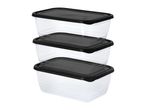 Three clear rectangular food storage containers with black lids, stacked vertically.