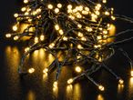 Warm white LED string lights on a dark surface, creating a festive glow.