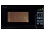 A black Sharp microwave oven with a digital display.