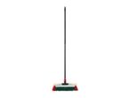 A broom with a black handle and red and green bristles.