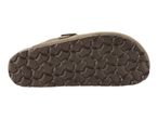 Bottom view of a brown sandal with a textured sole.