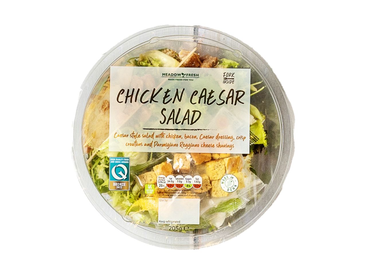 A container of prepared Chicken Caesar Salad.