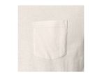 Close-up of a cream-colored t-shirt with a single chest pocket.