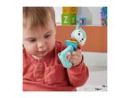 Baby playing with a colorful fox-shaped rattle toy.