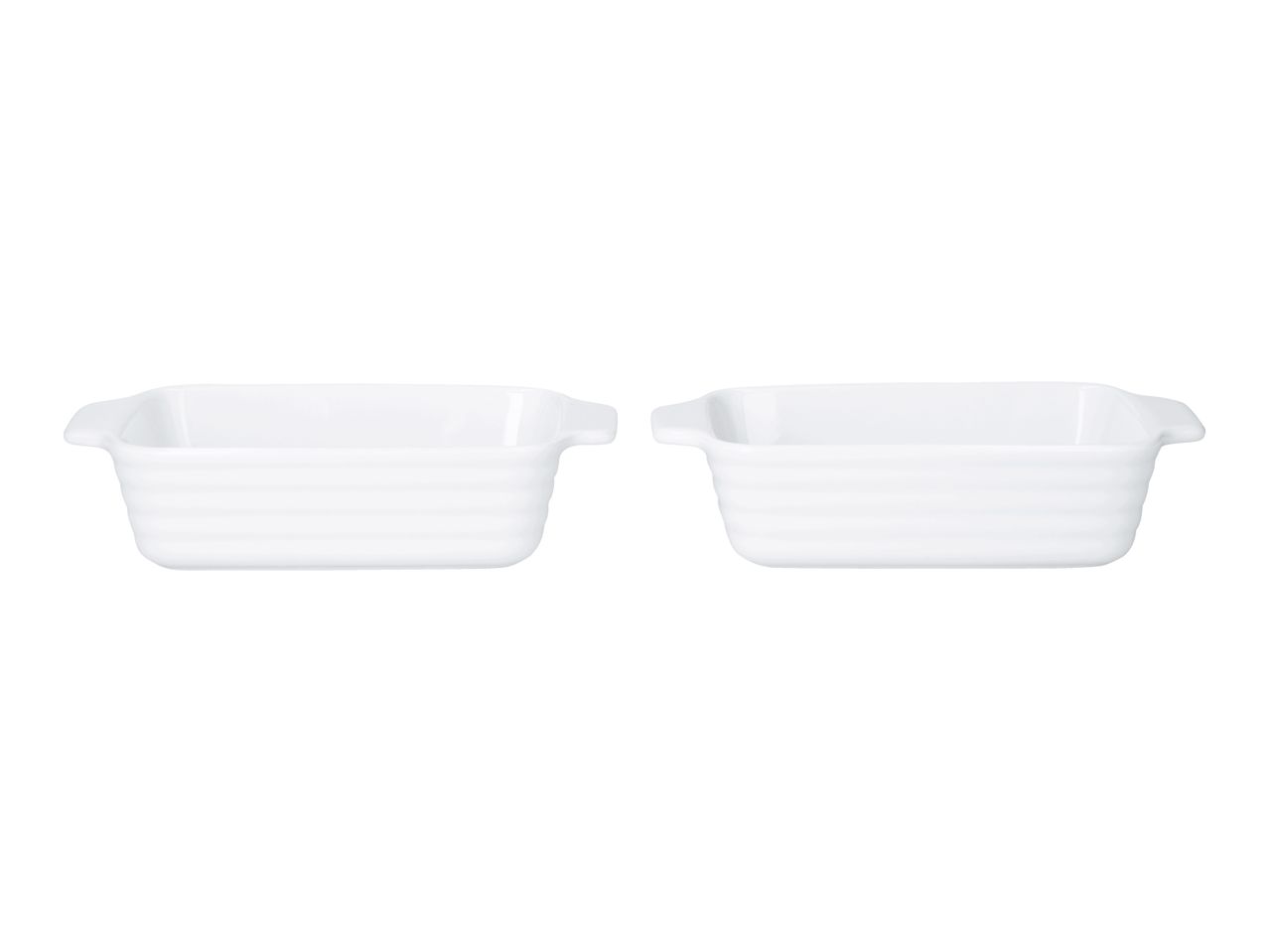 Two white rectangular ceramic baking dishes with ribbed sides and small handles