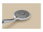 Chrome shower head with a grey spray plate and various nozzle types.