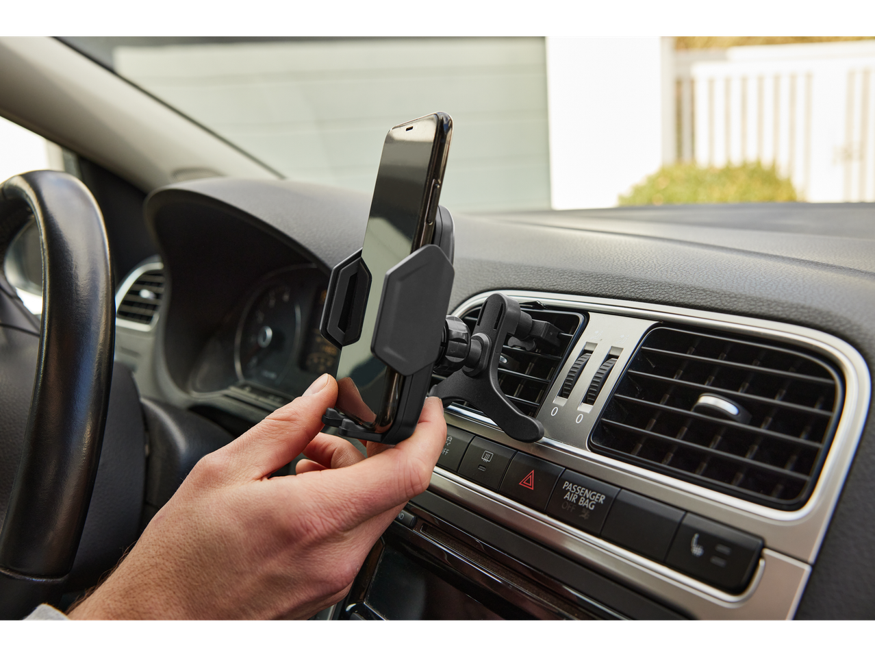 Car phone mount, smartphone in holder.