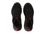 A pair of black Crivit hiking shoes with red accents.