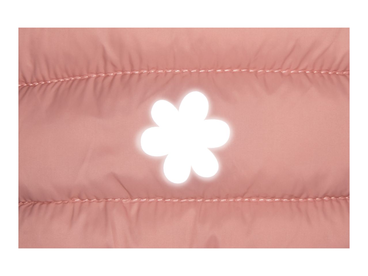 Close-up of a pink quilted jacket with a white flower-shaped cutout.