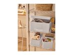 Chrome wire shelving unit with various storage boxes and household items.
