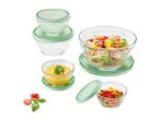 A set of glass storage bowls with mint green lids, ideal for food preparation and storage.