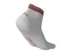 A white Crivit ankle sock with maroon and orange stripes at the top.
