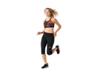 Woman running in a black and red patterned sports bra and black capri leggings.
