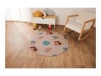 A child's room with a space-themed rug, a white storage bench, and a wooden rocking chair.