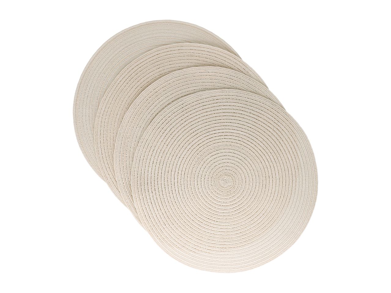 Stack of five round, woven beige placemats