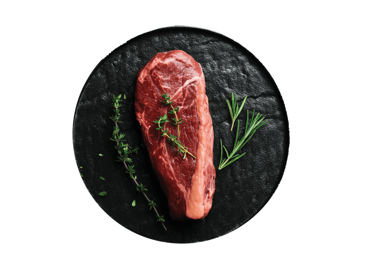 Žalias jautienos didkepsnis su rozmarinu ir čiobreliais ant juodos lėkštės.